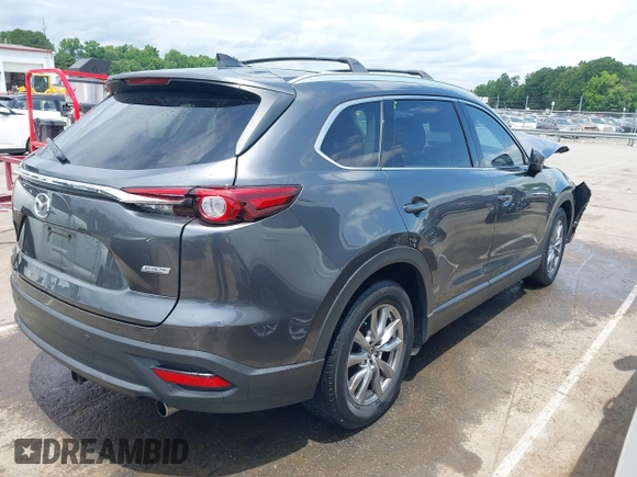 2019 Mazda CX-9 Touring with VIN JM3TCACY6K0334085, listed as a IAAI auction lot 42391595 with 113,723 mi miles and . Bid and sale history available at DreamBid. Image 4.
