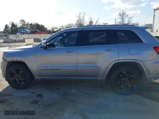 2015 Jeep Grand Cherokee Altitude with VIN 1C4RJFAG3FC210151, listed as a IAAI auction lot 41865151 with 122,579 mi miles. Bid and sale history available at carsss.com. Image 14.