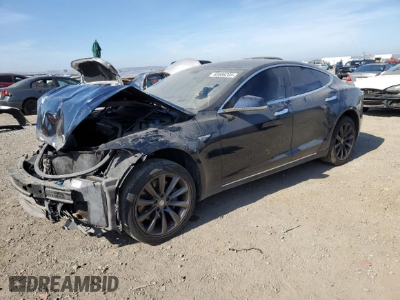 2014 Tesla Model S 60 with VIN 5YJSA1H13EFP38425, listed as a Copart auction lot 63686205 with 183,968 mi miles and Salvage title. Bid and sale history available at DreamBid. Image 1.