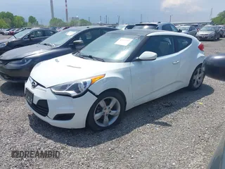 2015 Hyundai Veloster z VIN KMHTC6AD8FU228494, wystawiony jako IAAI lot #42231797 z przebiegiem 111 141 mil mil oraz . Historia ofert i sprzedaży dostępna na DreamBid. Obrazek 2.