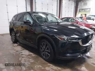 2018 Mazda CX-5 Grand Touring z VIN JM3KFBDM0J0325031, wystawiony jako IAAI lot #41655393 z przebiegiem 109 236 mil mil oraz . Historia ofert i sprzedaży dostępna na DreamBid. Obrazek 1.