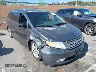 2011 Honda Odyssey Touring with VIN 5FNRL5H96BB009580, listed as a IAAI auction lot 42202595 with Not provided miles and . Bid and sale history available at DreamBid. Image 1.