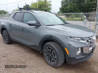 2023 Hyundai Santa Cruz SEL z VIN 5NTJCDAE6PH041342, wystawiony jako IAAI lot #42192227 z przebiegiem Nie podano mil oraz . Historia ofert i sprzedaży dostępna na DreamBid. Obrazek 1.
