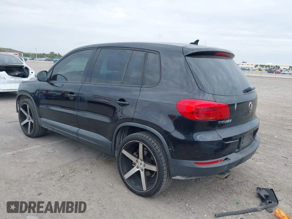 2014 Volkswagen Tiguan SE z VIN WVGAV3AXXEW535128, wystawiony jako IAAI lot #41882213 z przebiegiem 103 161 mil mil oraz . Historia ofert i sprzedaży dostępna na DreamBid. Obrazek 3.
