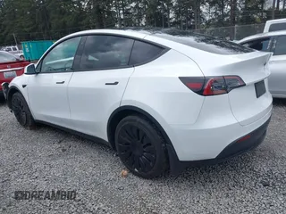 2023 Tesla Model Y Long Range z VIN 7SAYGAEEXPF647352, wystawiony jako IAAI lot #41955933 z przebiegiem Nie podano mil oraz . Historia ofert i sprzedaży dostępna na DreamBid. Obrazek 3.