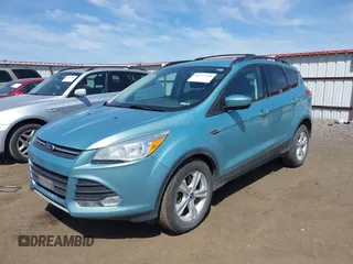 2013 Ford Escape SE with VIN 1FMCU9GX0DUC79114, listed as a IAAI auction lot 42237118 with 176,413 mi miles and . Bid and sale history available at DreamBid. Image 2.