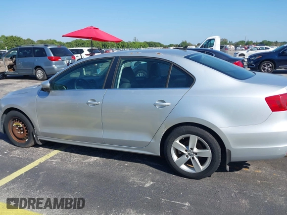 2013 Volkswagen Jetta TDI w/Premium with VIN 3VWLL7AJ0DM385077, listed as a IAAI auction lot 42322406 with 63,428 mi miles and . Bid and sale history available at DreamBid. Image 6.