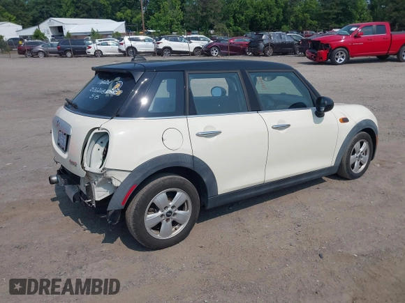 2015 MINI Hardtop 4 Door with VIN WMWXS5C5XFT827330, listed as a IAAI auction lot 42402965 with 140,648 mi miles and . Bid and sale history available at DreamBid. Image 4.