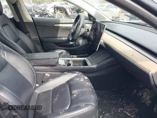 2023 Tesla Model 3 z VIN 5YJ3E1EA5PF451085, wystawiony jako IAAI lot #41941655 z przebiegiem 56 532 mil mil oraz . Historia ofert i sprzedaży dostępna na DreamBid. Obrazek 5.