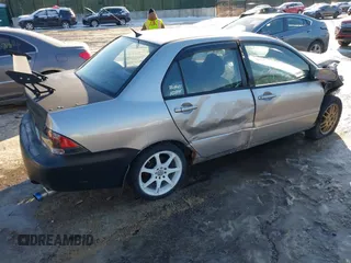 2006 Mitsubishi Lancer OZ-Rally with VIN JA3AJ86E56U000207, listed as a IAAI auction lot 41401698 with 239,219 mi miles. Bid and sale history available at carsss.com. Image 4.