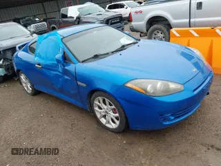 2008 Hyundai Tiburon GT z VIN KMHHN66FX8U282926, wystawiony jako IAAI lot #41959023 z przebiegiem 119 414 mil mil oraz . Historia ofert i sprzedaży dostępna na DreamBid. Obrazek 1.