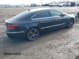 2014 Volkswagen CC Sport with VIN WVWBP7AN4EE534247, listed as a IAAI auction lot 41542076 with 119,199 mi miles and . Bid and sale history available at DreamBid. Image 4.