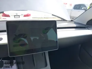 2023 Tesla Model 3 z VIN 5YJ3E1EAXPF414646, wystawiony jako IAAI lot #39514743 z przebiegiem 10 529 mil mil oraz . Historia ofert i sprzedaży dostępna na DreamBid. Obrazek 18.