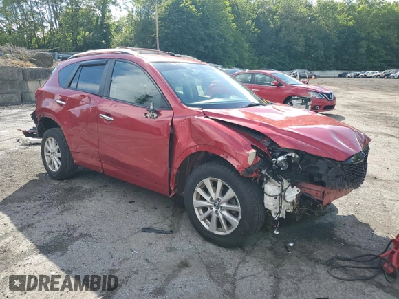 2015 Mazda CX-5 Sport with VIN JM3KE4BY9F0479748, listed as a Copart auction lot 58847805 with 122,698 mi miles and Salvage title. Bid and sale history available at DreamBid. Image 4.