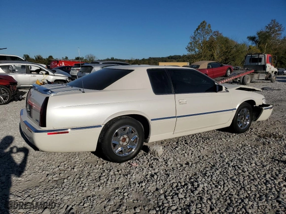 2000 Cadillac Eldorado with VIN 1G6EL12Y5YU176121, listed as a Copart auction lot 77123914 with 91,663 mi miles and Salvage Title. Bid and sale history available at carsss.com. Image 3.