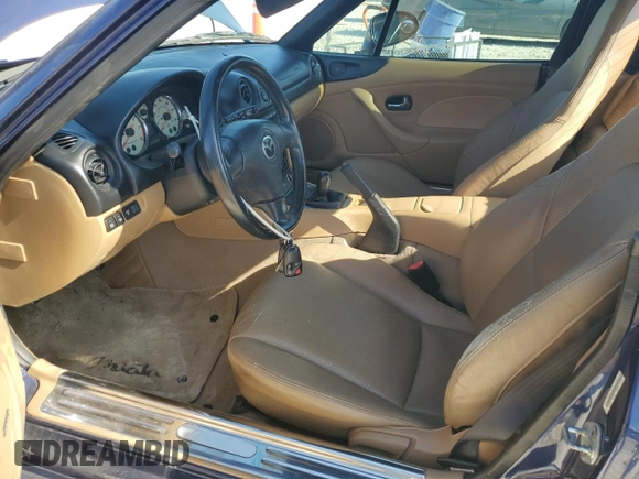 2002 Mazda MX-5 Miata Cloth z VIN JM1NB353720231873, wystawiony jako Copart lot #52398015 z przebiegiem 90 077 mil mil oraz Szkoda całkowita • Salvage title. Historia ofert i sprzedaży dostępna na DreamBid. Obrazek 7.