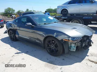 2020 Ford Mustang EcoBoost z VIN 1FA6P8TH1L5183279, wystawiony jako IAAI lot #41904731 z przebiegiem 99 222 mil mil oraz . Historia ofert i sprzedaży dostępna na DreamBid. Obrazek 1.