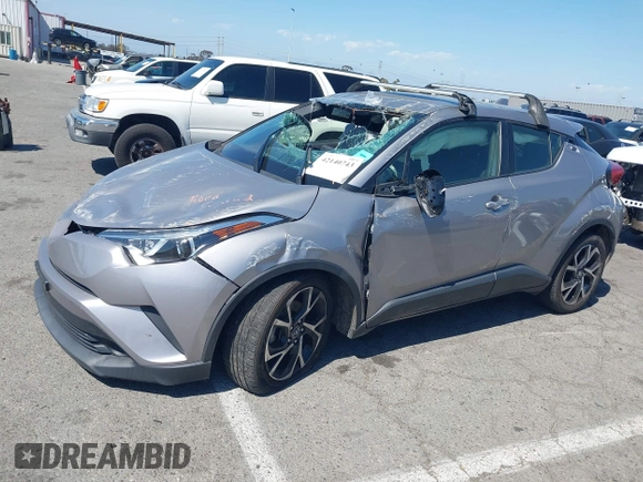 2019 Toyota C-HR XLE with VIN JTNKHMBX8K1046347, listed as a IAAI auction lot 42140743 with 49,918 mi miles and . Bid and sale history available at DreamBid. Image 2.