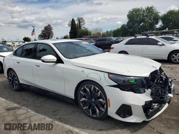 2024 BMW i5 eDrive40 with VIN WBY33FK04RCR92576, listed as a Copart auction lot 51180875 with 11,289 mi miles and Salvage title. Bid and sale history available at DreamBid. Image 4.
