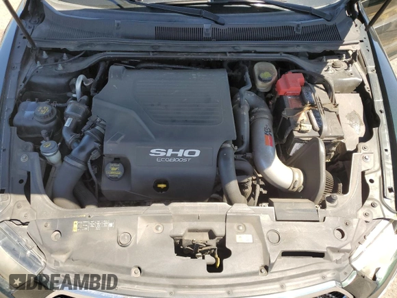 2013 Ford Taurus SHO z VIN 1FAHP2KT8DG173401, wystawiony jako Copart lot #54736195 z przebiegiem 176 507 mil mil oraz Szkoda całkowita • Salvage title. Historia ofert i sprzedaży dostępna na DreamBid. Obrazek 11.
