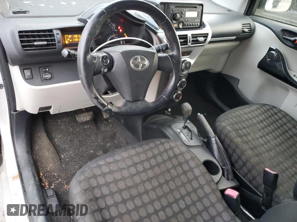 2012 Scion iQ with VIN JTNJJXB03CJ018641, listed as a Copart auction lot 82653104 with 118,617 mi miles and Salvage Title. Bid and sale history available at carsss.com. Image 8.