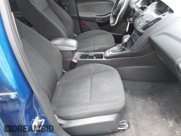 2018 Ford Focus SE z VIN 1FADP3F21JL212029, wystawiony jako IAAI lot #42258350 z przebiegiem 91 939 mil mil oraz . Historia ofert i sprzedaży dostępna na DreamBid. Obrazek 5.