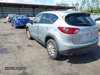 2016 Mazda CX-5 Touring z VIN JM3KE4CY4G0646114, wystawiony jako IAAI lot #42269181 z przebiegiem 58 252 mil mil oraz . Historia ofert i sprzedaży dostępna na DreamBid. Obrazek 3.