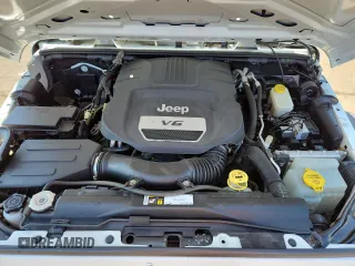 2015 Jeep Wrangler Unlimited Freedom with VIN 1C4HJWDGXFL755528, listed as a Copart auction lot 64927525 with 111,096 mi miles and Salvage title. Bid and sale history available at DreamBid. Image 11.