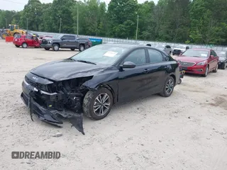 2023 Kia Forte LXS with VIN 3KPF24AD1PE594919, listed as a IAAI auction lot 42158476 with 34,719 mi miles and . Bid and sale history available at DreamBid. Image 2.