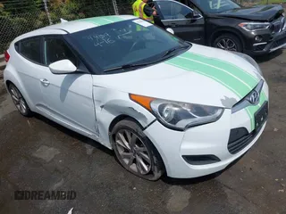 2016 Hyundai Veloster z VIN KMHTC6AD9GU265426, wystawiony jako IAAI lot #42119084 z przebiegiem 125 301 mil mil oraz . Historia ofert i sprzedaży dostępna na DreamBid. Obrazek 1.