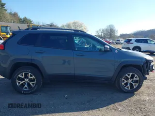 2014 Jeep Cherokee Trailhawk with VIN 1C4PJMBS4EW179763, listed as a IAAI auction lot 41988048 with 152,681 mi miles. Bid and sale history available at carsss.com. Image 14.