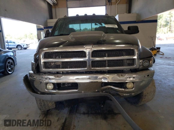 2002 Dodge Ram 2500 with VIN 3B7KF23C82M255391, listed as a Copart auction lot 73115584 with 216,242 mi miles and Salvage Title. Bid and sale history available at carsss.com. Image 5.