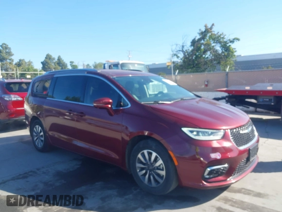 2021 Chrysler Pacifica Hybrid Touring L with VIN 2C4RC1L76MR581285, listed as a IAAI auction lot 42303222 with 77,808 mi miles and . Bid and sale history available at DreamBid. Image 6.