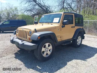 2013 Jeep Wrangler Sport with VIN 1C4AJWAG8DL676619, listed as a IAAI auction lot 41942627 with 130,306 mi miles. Bid and sale history available at carsss.com. Image 2.