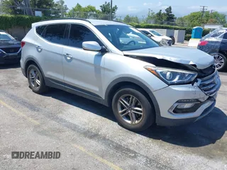 2017 Hyundai Santa Fe 2.4L z VIN 5XYZU3LB9HG417021, wystawiony jako IAAI lot #42386212 z przebiegiem 82 545 mil mil oraz . Historia ofert i sprzedaży dostępna na DreamBid. Obrazek 1.