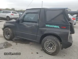 1994 Geo Tracker z VIN 2CNBE18U9R6936156, wystawiony jako Copart lot #45881915 z przebiegiem 201 227 mil mil oraz Szkody całkowita. Historia ofert i sprzedaży dostępna na DreamBid. Obrazek 2.