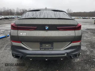 2023 BMW X6 xDrive40i z VIN 5UXCY6C03P9P48220, wystawiony jako Copart lot #51660845 z przebiegiem 24 947 mil mil oraz Szkoda całkowita • Salvage title. Historia ofert i sprzedaży dostępna na DreamBid. Obrazek 6.