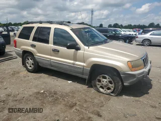 1999 Jeep Grand Cherokee Laredo with VIN 1J4GW58N7XC799434, listed as a Copart auction lot 64790905 with 272,384 mi miles and Salvage title. Bid and sale history available at DreamBid. Image 4.