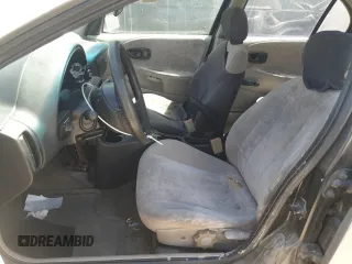 1999 Saturn SL z VIN 1G8ZK5271XZ316032, wystawiony jako Copart lot #50663015 z przebiegiem 164 288 mil mil oraz Nie do naprawy. Historia ofert i sprzedaży dostępna na DreamBid. Obrazek 7.