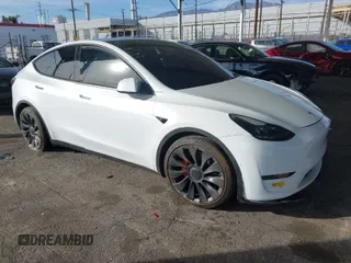 2021 Tesla Model Y Performance with VIN 5YJYGDEF5MF277804, listed as a IAAI auction lot 41421518 with 154,033 mi miles. Bid and sale history available at carsss.com. Image 1.