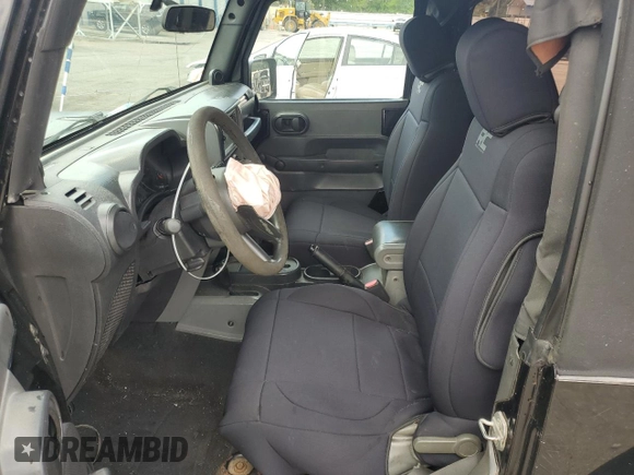 2009 Jeep Wrangler X with VIN 1J4FA24199L783458, listed as a Copart auction lot 56542705 with 236,840 mi miles and Salvage title. Bid and sale history available at DreamBid. Image 7.