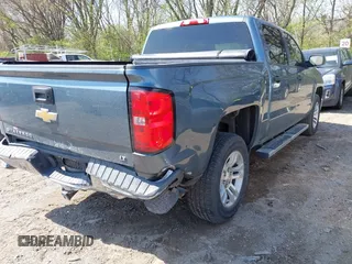 2014 Chevrolet Silverado 1500 LT with VIN 3GCUKREH9EG313565, listed as a IAAI auction lot 42003086 with 112,322 mi miles and . Bid and sale history available at DreamBid. Image 4.