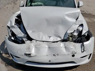 2024 Tesla Model Y Long Range z VIN 7SAYGDEE0RA313929, wystawiony jako Copart lot #59548725 z przebiegiem Nie podano mil oraz Szkoda całkowita • Salvage title. Historia ofert i sprzedaży dostępna na DreamBid. Obrazek 11.