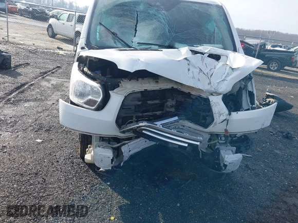 2019 Ford Transit z VIN 1FTYR2ZM6KKB81879, wystawiony jako IAAI lot #41485213 z przebiegiem 153 036 mil mil oraz . Historia ofert i sprzedaży dostępna na DreamBid. Obrazek 6.