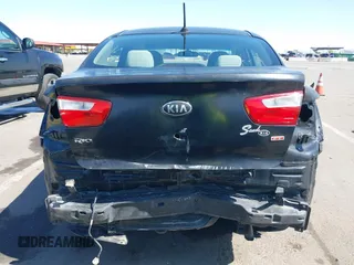 2014 Kia Rio LX with VIN KNADM4A39E6364490, listed as a IAAI auction lot 42128702 with 130,981 mi miles and . Bid and sale history available at DreamBid. Image 17.