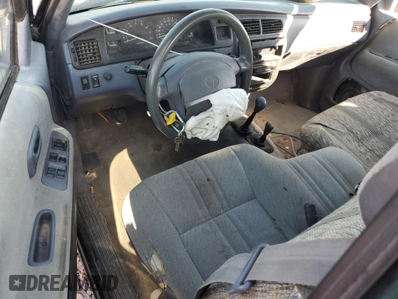 1997 Toyota T100 DX with VIN JT4UN22D7V0035205, listed as a Copart auction lot 75953824 with 196,449 mi miles and Salvage Title. Bid and sale history available at DreamBid. Image 8.