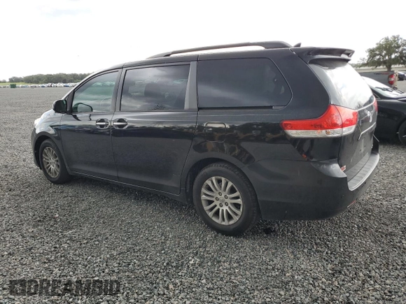 2012 Toyota Sienna XLE AAS with VIN 5TDYK3DC1CS279236, listed as a Copart auction lot 63329165 with 143,937 mi miles and Salvage title. Bid and sale history available at DreamBid. Image 2.
