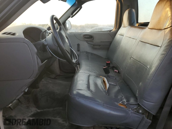 2003 Ford F-150 XL with VIN 1FTRF17W13NA97772, listed as a Copart auction lot 77692074 with Not Provided miles and Salvage Title. Bid and sale history available at DreamBid. Image 7.