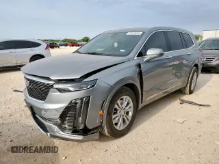 2024 Cadillac XT6 FWD Luxury with VIN 1GYKPAR41RZ700452, listed as a Copart auction lot 57675945 with 27,449 mi miles and Salvage title. Bid and sale history available at DreamBid. Image 1.