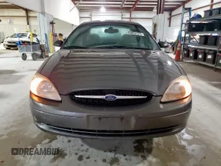 2002 Ford Taurus SES Standard z VIN 1FAFP55U72A161401, wystawiony jako Copart lot #55893125 z przebiegiem 128 258 mil mil oraz Czysty tytuł • Clean title. Historia ofert i sprzedaży dostępna na DreamBid. Obrazek 5.